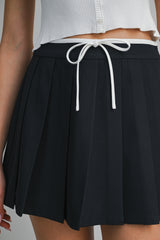JARA PLEATED TIE FRONT SKORT