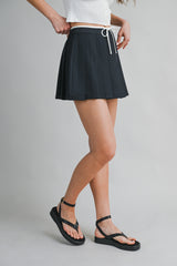 JARA PLEATED TIE FRONT SKORT