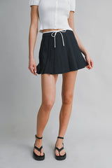 JARA PLEATED TIE FRONT SKORT