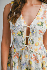 DAISY PRINTED SLEEVELESS TIE FRONT ROMPER
